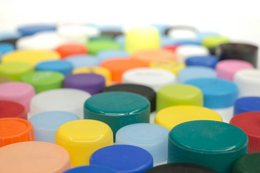 Close-up of many colorful bottle caps